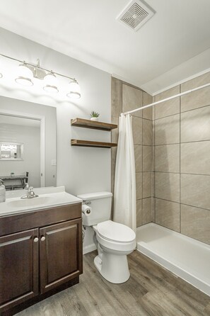 Shower, hair dryer, towels, soap