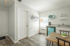 Fridge, microwave, coffee/tea maker, cookware/dishes/utensils