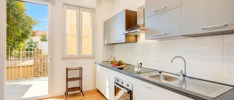 Family Apartment, 1 Bedroom, Terrace, Sea Facing (Casa Angerin 3 - 100m from sea) | Private kitchen | Fridge, oven, stovetop, coffee/tea maker