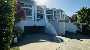 A modern building with multiple balconies and a clear sky. - Modern Apartment in Chevron Island (Surfers Paradise)