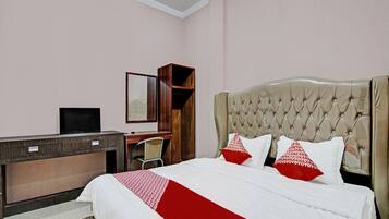 Desk, laptop workspace, bed sheets