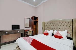 Desk, laptop workspace, bed sheets