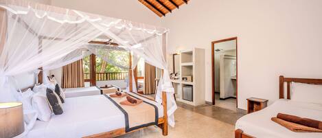 A bedroom with a wooden ceiling, a bed with a canopy, a bedside table, and a mirror.