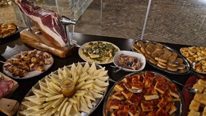 A buffet with various dishes including meats, cheeses, and salads. - Agritourism in val d'orcia (montalcino)