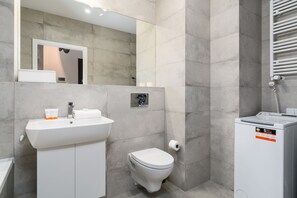 Bathtub, hair dryer, towels