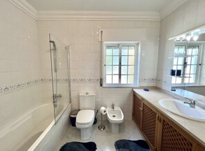 Bathtub, hair dryer, towels