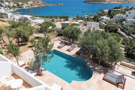 Seasonal outdoor pool, open 11:00 AM to 8:00 PM, sun loungers. Golden Sun Hotel Patmos