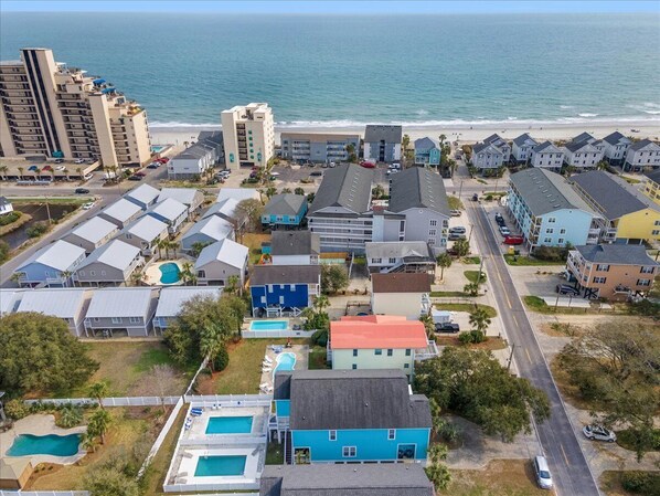 Enjoy ocean views from this coastal neighborhood with single-family homes and apartment buildings, featuring swimming pools and well-maintained streets.