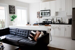Enjoy cooking in this well-equipped kitchen with a microwave, oven, and refrigerator.