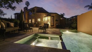 A house with a swimming pool, outdoor furniture, and a patio area. - Stunning Spanish Pool Home (Glendale)