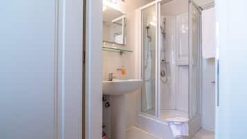 Superior Room, 1 Queen Bed | Bathroom | Shower, rainfall showerhead, hair dryer, slippers