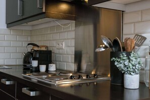Fridge, microwave, stovetop, coffee/tea maker