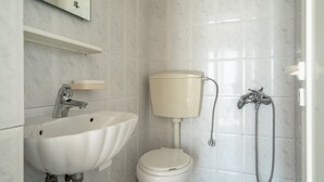 A bathroom with a sink, toilet, and shower. - Room "Angela sea view 4" with sea view, Wi-Fi, and air conditioning (kefalonia)
