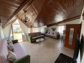 Family Duplex, City View | Living area | 38-inch plasma TV with satellite channels