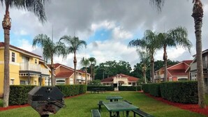 Outdoor dining - 4BR Disney Villa w/ Private Pool - Lake Berkley Resort (Kissimmee)