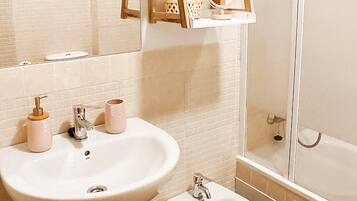 Shower, towels, toilet paper