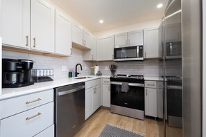 Microwave, stovetop, dishwasher, coffee/tea maker