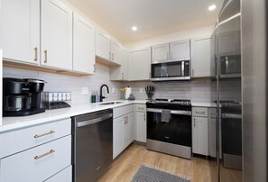 Microwave, stovetop, dishwasher, coffee/tea maker