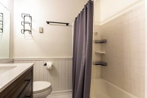 Shower, hair dryer, towels, shampoo