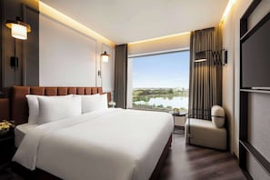 Deluxe Room, 1 King Bed | Individually furnished, desk, laptop workspace, bed sheets