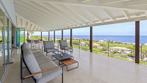 A spacious balcony with a view of the sea, furnished with a sofa, chairs, and a table. - Villa blue Oasis, Coral Estate, Curacao (Willemstad, Curacao, Curacao, Caribbean)