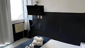 Suíte | Frigobar, Wi-Fi de cortesia, roupa de cama