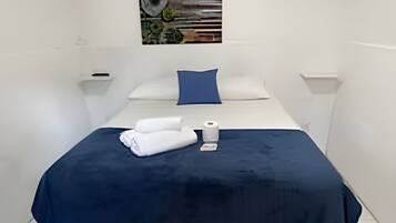 Suíte básica | Frigobar, Wi-Fi de cortesia, roupa de cama