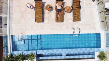 Outdoor pool, open 7:00 AM to 10:00 PM, sun loungers