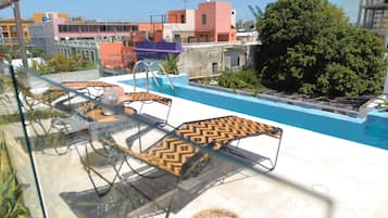 Outdoor pool, open 7:00 AM to 10:00 PM, sun loungers
