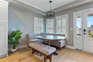Enjoy meals around the round dining table, surrounded by a comfortable bench.