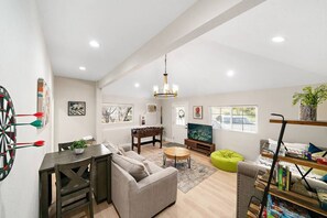 Smart TV, fireplace, foosball, books