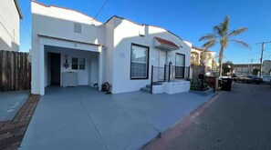 Situated on a quiet street, this single-story building offers a parking area and a convenient sidewalk location.