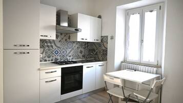 Fridge, oven, dining tables