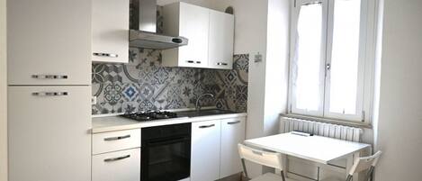 Fridge, oven, dining tables