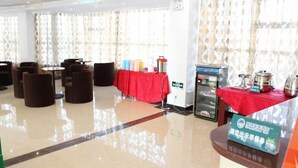 A hotel lobby with a red table, seating area, and a refrigerator. - Greentree Inn Shanghai Songjiang Wanda Plaza Rongmei Road Express Hotel (Shanghai)