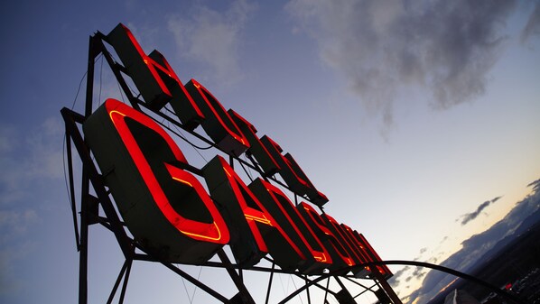 A large, illuminated sign with the text "GOLD GATE" against a sky backdrop. - The Gadsden Hotel  (Douglas)