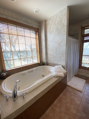 Jetted tub, hair dryer, towels, soap
