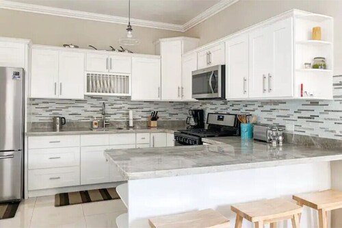 Spacious 3 BR  family home in quiet gated community. Central to attractions.