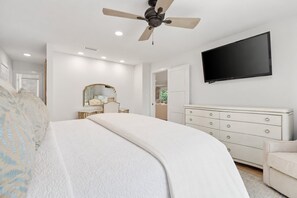 A bedroom with a bed, a dresser, a television, and a ceiling fan. - Seaside Retreat - 3BR/3BA Gulf-Front Home - Private Pool & Beach Walkover - Sleeps 10 (Santa Rosa Beach)