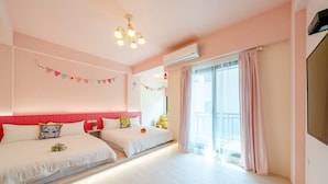 A hotel room with two beds, a ceiling light, an air conditioning unit, and a large window with curtains. - man man (Wujie)