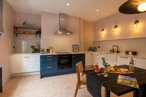 Fridge, oven, dishwasher, dining tables