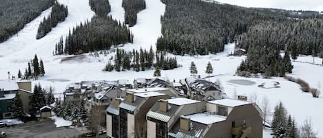 A ski resort with buildings and a ski slope.
