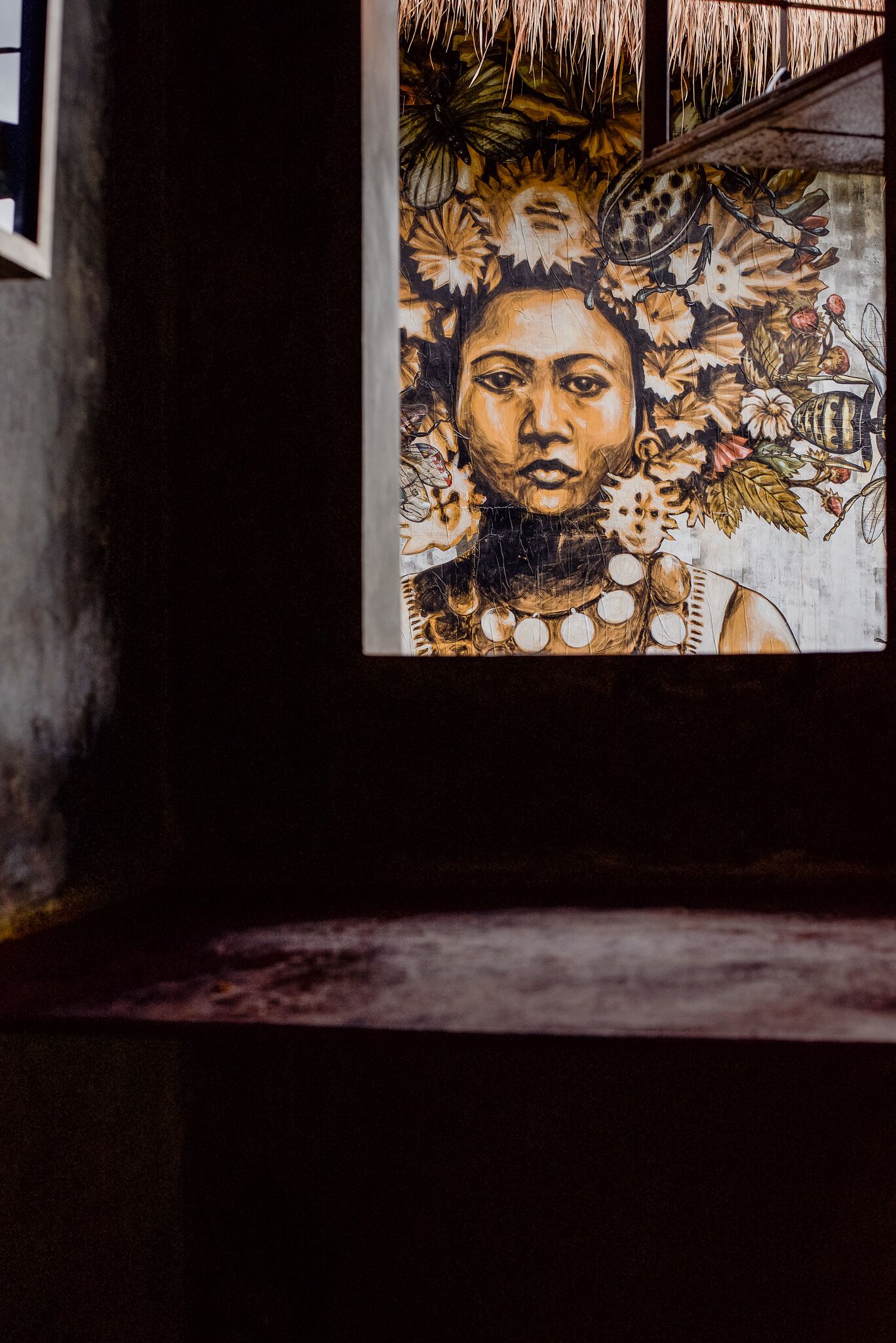 A mural with a floral and geometric pattern.