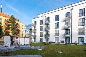 Residents can enjoy communal outdoor space with balconies and a garden area.