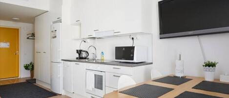 Fridge, coffee/tea maker, cookware/dishes/utensils