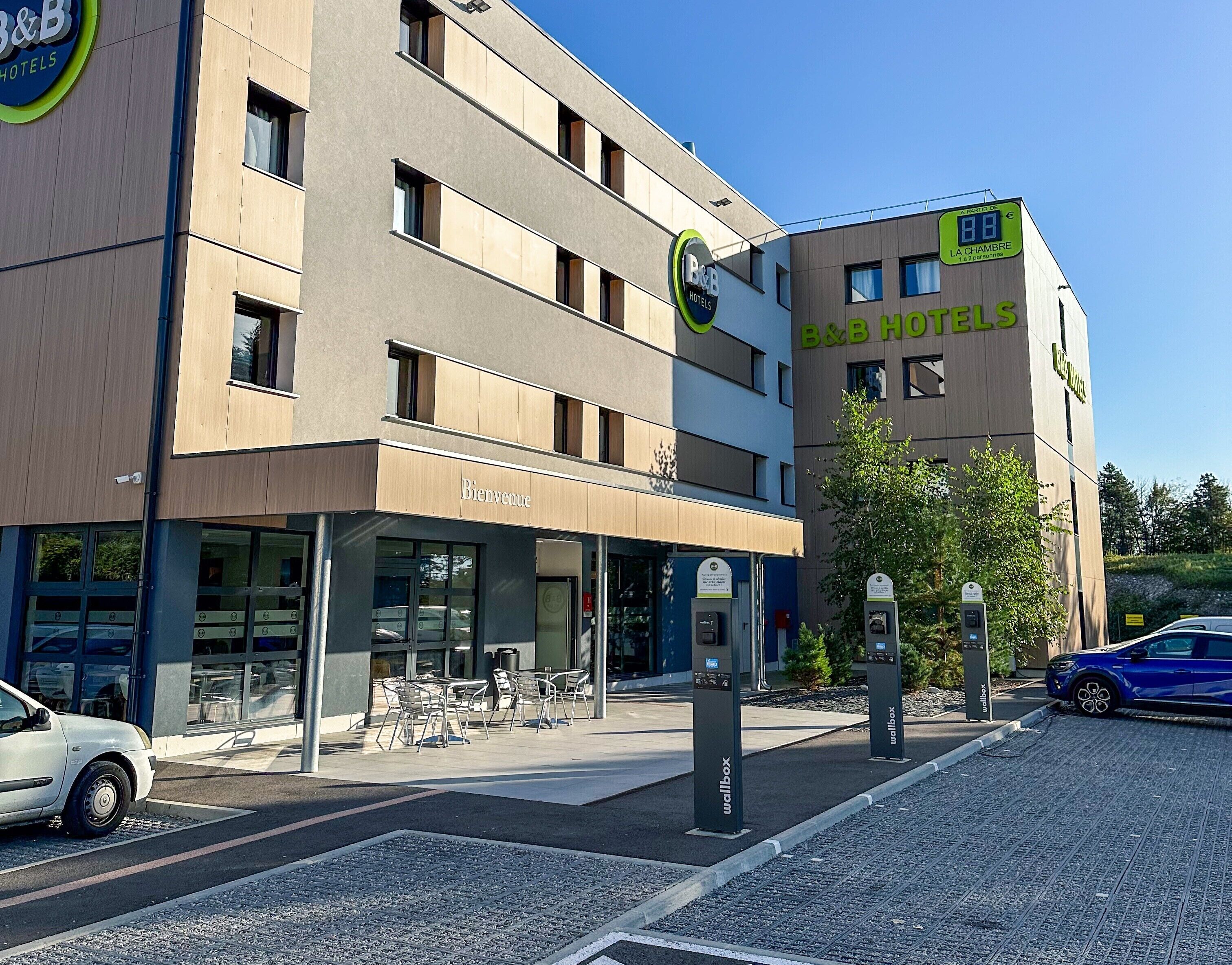 A B&B hotel with a visible entrance, outdoor seating, and a well-maintained facade.