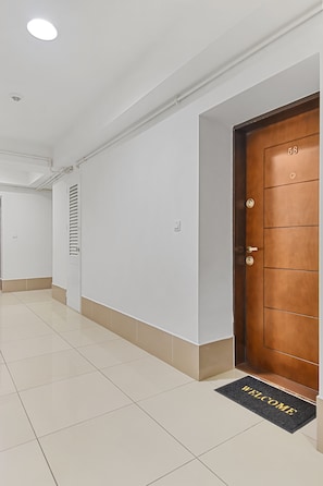 Leading to an entrance with a welcoming doormat.