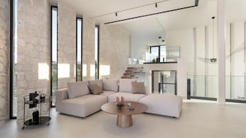 Villa de diseñador | Área de sala de estar | Smart TV de 65 pulgadas con canales vía satélite, televisión y Netflix