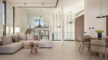 Design Villa | Living area | 65-inch Smart TV with satellite channels, TV, Netflix