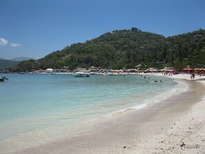 On the beach, sun-loungers